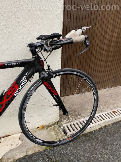 EXS CLM tri - 8
